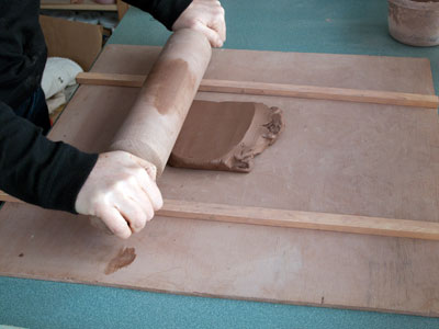 No slab roller? No problem! All you need are two same-sized sticks and a rolling pin.