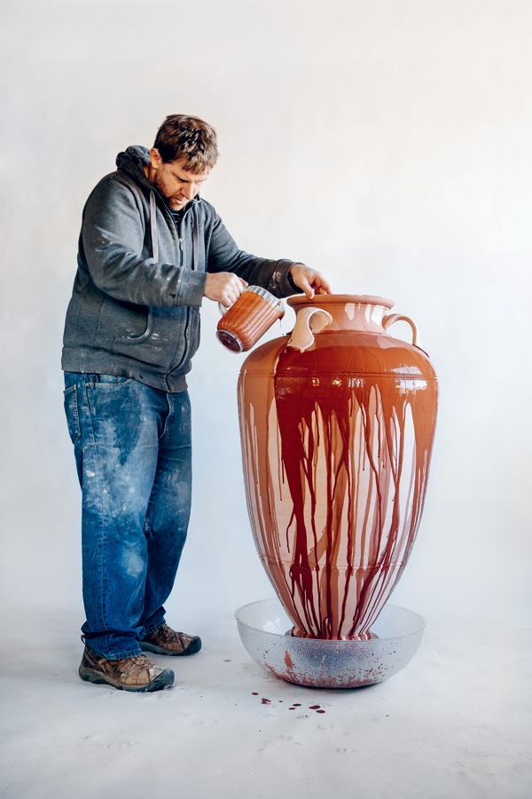 2 An example of pouring glaze onto a large piece using a large bowl to catch overrun.