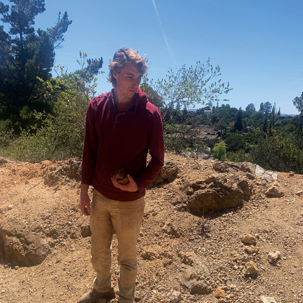 C Fishman collecting an iron-rich rock for use in tenmoku glazes and iron decorations. Photo: Kate Gibbs.