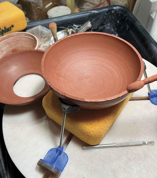 5 Secure the trimmed bottom bowl on a piece of foam before attaching the trimmed top bowl. Smooth the join.