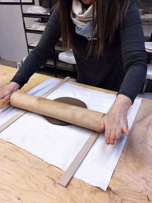 1 Use two wooden slats of the same thickness and a rolling pin to roll out a slab that’s no thicker than ¼ inch.