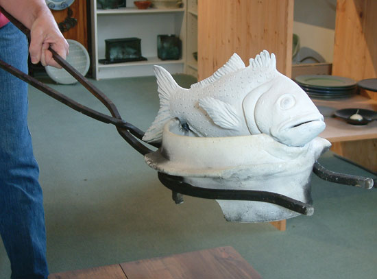 The fish are fired in bisque-firing cradles and specially-designed tongs are used to easily remove them from the kiln for post-firing reduction.