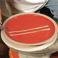 1 Using a slip trailer, add multiple colors of slip onto the platter.