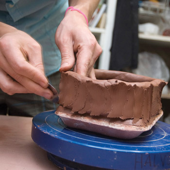 Fig.3 Blend the coils to form the walls of the flower brick using a serrated metal rib.