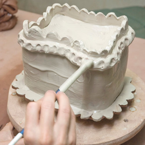 Fig.10 Paint the completed piece with white slip, to echo frosting on a cake.