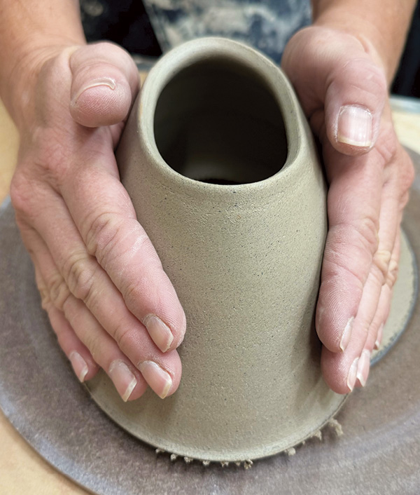 8 After throwing, leave the cone to firm up to medium leather hard on the bat. Wire off and gently press into an oval.