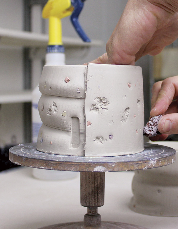 7 Texture the mug with lava rocks. These marks will pool the Mason-stain wash.