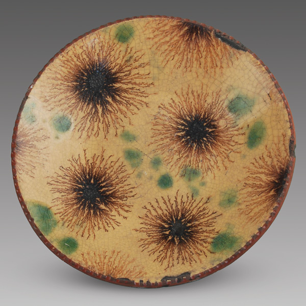 1 Wisconsin Pottery’s platter with dendritic slip pattern, 9 in. (23 cm) in diameter, fired in oxidation to cone 04.