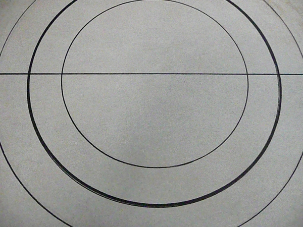 2 Mark the center diameter of the circle and drill holes appropriate for your wheel pegs. Mark the height of the wheel pegs on the drill bit with tape (so you do not go all the way through the cement board).